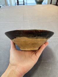 A Samanid pottery 'Kufic' inscribed bowl and a white-spotted brown-ground bowl, Iran, 10th C.