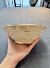 A Samanid pottery 'Kufic' inscribed bowl and a white-spotted brown-ground bowl, Iran, 10th C.