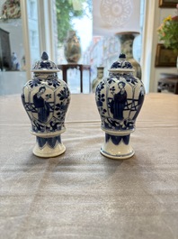 A pair of Chinese blue and white 'Long Eliza and playing boys' covered vases, Kangxi