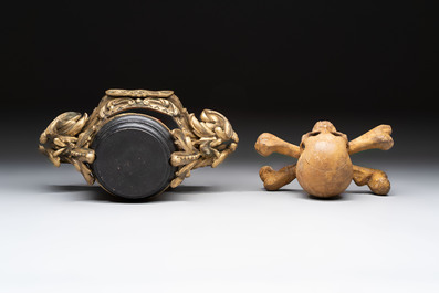 An Italian 'vanitas' or 'memento mori' skull with wooden crossbones on gilt-bronze base, 18/19th C.