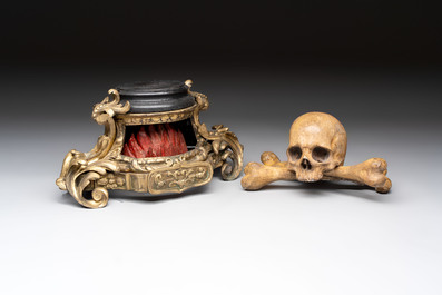An Italian 'vanitas' or 'memento mori' skull with wooden crossbones on gilt-bronze base, 18/19th C.