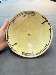A Samanid pottery 'Kufic' inscribed bowl and a white-spotted brown-ground bowl, Iran, 10th C.