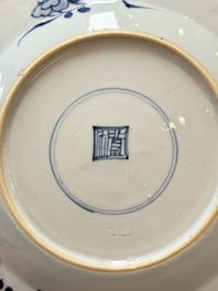 Nine Chinese blue and white plates with figural design, 18th C.