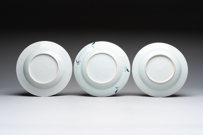 18 Chinese blue and white plates and saucers with floral design, 18th C.