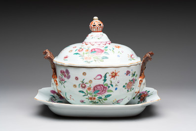 A Chinese famille rose 'mascarons' tureen and cover on stand with floral design, Qianlong