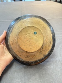 A Samanid pottery 'Kufic' inscribed bowl and a white-spotted brown-ground bowl, Iran, 10th C.