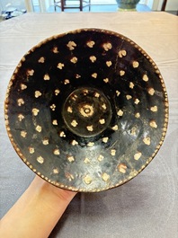 A Samanid pottery 'Kufic' inscribed bowl and a white-spotted brown-ground bowl, Iran, 10th C.