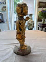 A rare and large Chinese gilt-lacquered bronze Buddha, Ming