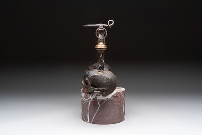 An Italian 'vanitas' or 'memento mori' composition with skulls and forged iron mount, 18/19th C.