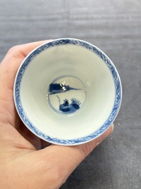 A pair of Chinese blue and white 'elegant beauty and boy' cups and saucers, Chenghua mark, Kangxi