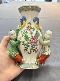 A Chinese famille rose covered teapot and a pair of Samson wall pocket vases, Tongzhi mark, 19th C.