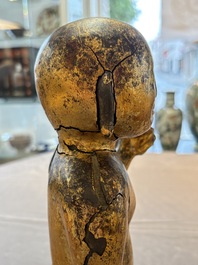 A rare and large Chinese gilt-lacquered bronze Buddha, Ming