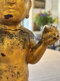 A rare and large Chinese gilt-lacquered bronze Buddha, Ming