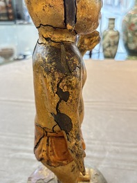 A rare and large Chinese gilt-lacquered bronze Buddha, Ming