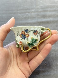 Two Chinese gilt-decorated famille rose cups and saucers with floral design, Qianlong