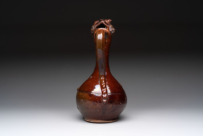 An Ottoman Canakkale pottery ewer with applied floral rosettes, Turkey, 19th C