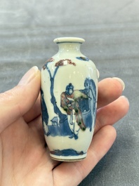 A Chinese peachbloom-crackle-glazed 'meiping' snuff bottle and a figural blue, white and copper-red snuff bottle, Yongzheng mark, 19th C.