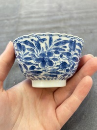 A set of six Chinese blue and white cups and saucers with floral design, Kangxi