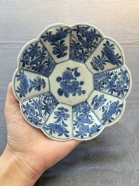 Three Japanese blue and white flower-shaped plates and a 'fisherman' dish, Edo, 17/18th C.
