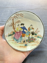 A pair of Chinese famille rose 'European subject' cups and saucers, Qianlong