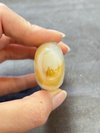 A collection of nine Chinese agate snuff bottles, 20th C.