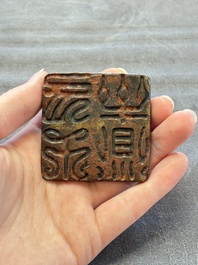 Five Chinese bronze seals and an Indonesian bronze figure group, 18/19th C.