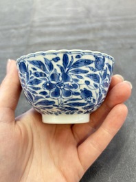 A set of six Chinese blue and white cups and saucers with floral design, Kangxi