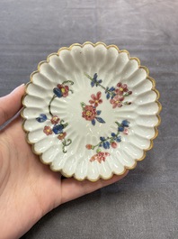 Two Chinese gilt-decorated famille rose cups and saucers with floral design, Qianlong