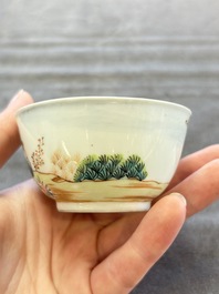 A pair of Chinese famille rose 'European subject' cups and saucers, Qianlong