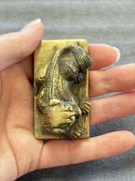 Five Chinese bronze seals and an Indonesian bronze figure group, 18/19th C.