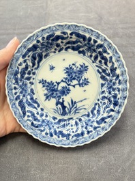 A set of six Chinese blue and white cups and saucers with floral design, Kangxi