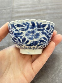 A set of six Chinese blue and white cups and saucers with floral design, Kangxi