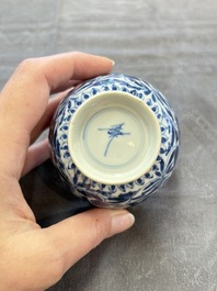A set of six Chinese blue and white cups and saucers with floral design, Kangxi