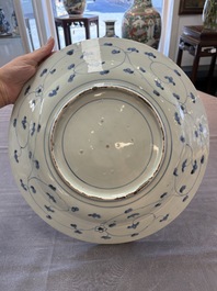 Three Japanese blue and white flower-shaped plates and a 'fisherman' dish, Edo, 17/18th C.