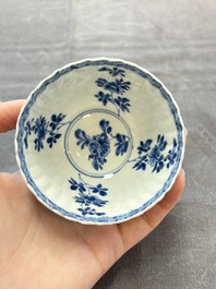 A set of six Chinese blue and white cups and saucers with floral design, Kangxi