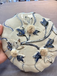 A Chinese blue and white ko-sometsuke flower-shaped tripod 'landscape' plate for the Japanese market, late Ming