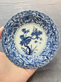 A set of six Chinese blue and white cups and saucers with floral design, Kangxi