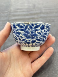 A set of six Chinese blue and white cups and saucers with floral design, Kangxi