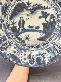 Three Japanese blue and white flower-shaped plates and a 'fisherman' dish, Edo, 17/18th C.