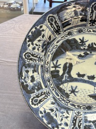Three Japanese blue and white flower-shaped plates and a 'fisherman' dish, Edo, 17/18th C.