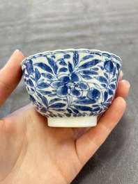 A set of six Chinese blue and white cups and saucers with floral design, Kangxi