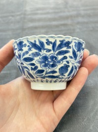 A set of six Chinese blue and white cups and saucers with floral design, Kangxi