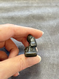 Five Chinese bronze seals and an Indonesian bronze figure group, 18/19th C.
