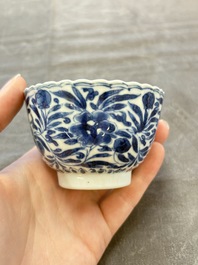 A set of six Chinese blue and white cups and saucers with floral design, Kangxi
