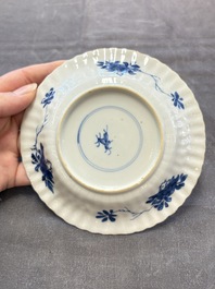 A set of six Chinese blue and white cups and saucers with floral design, Kangxi