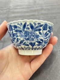 A set of six Chinese blue and white cups and saucers with floral design, Kangxi
