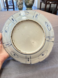 Three Chinese blue and white 'kraak' dishes with a bird and flowers, Wanli