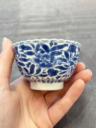 A set of six Chinese blue and white cups and saucers with floral design, Kangxi