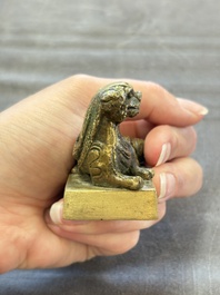 Five Chinese bronze seals and an Indonesian bronze figure group, 18/19th C.