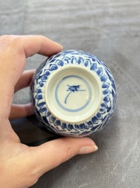 A set of six Chinese blue and white cups and saucers with floral design, Kangxi